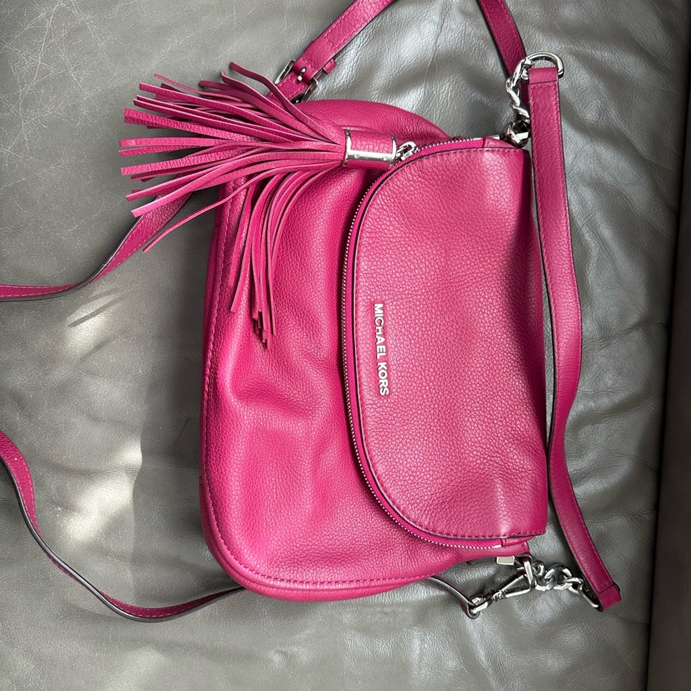 Vibrant Pink Crossbody Bag with Tassel and Adjustable Strap
